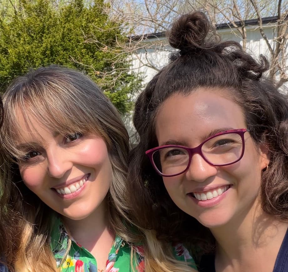 Alessa and Carolyng, Homa's co-founders, smiling together outside in the sun